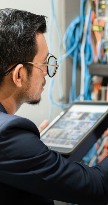 technician working on server room cabling