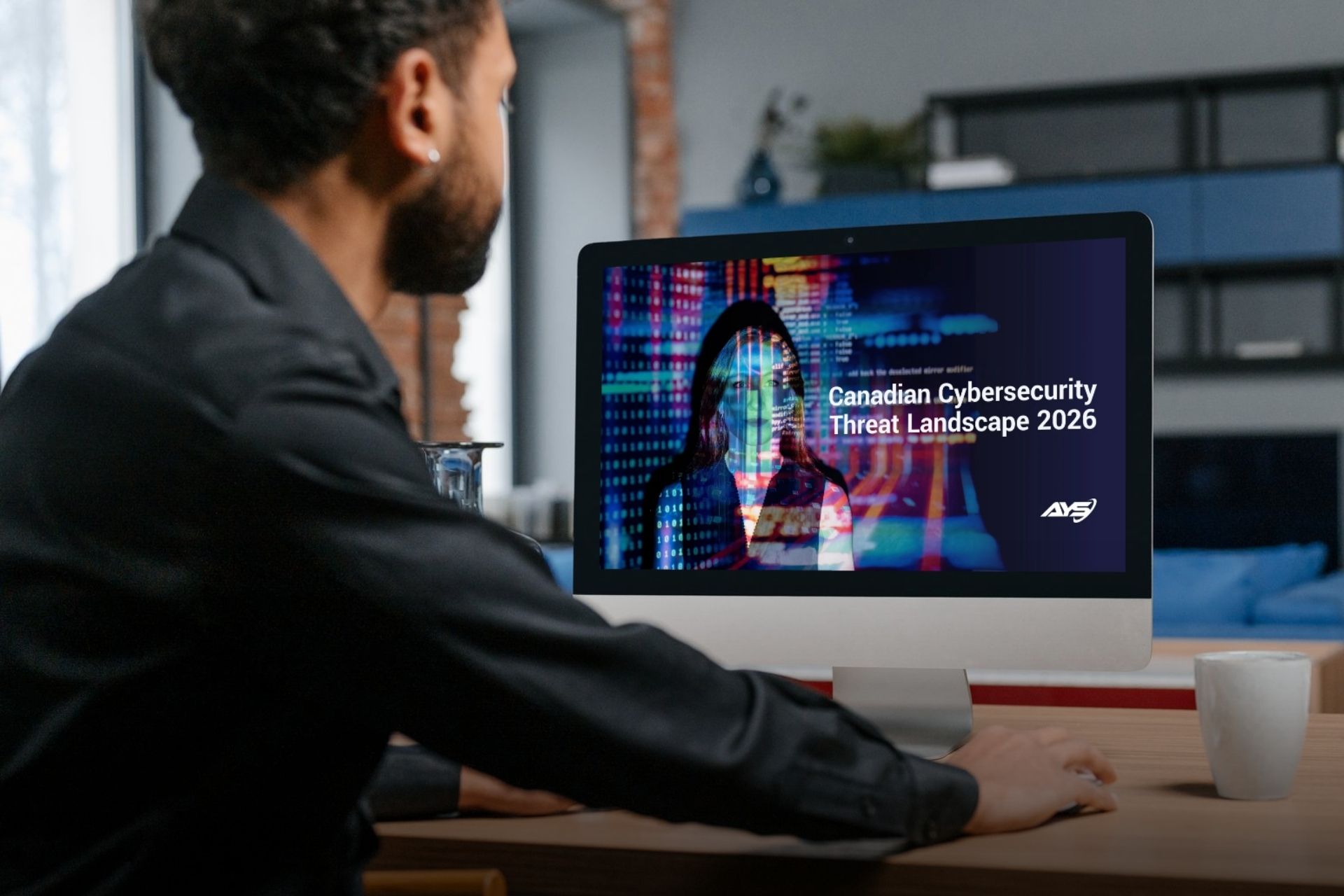 man looks at cyber report to learn insider threats in 2026 affecting small businesses