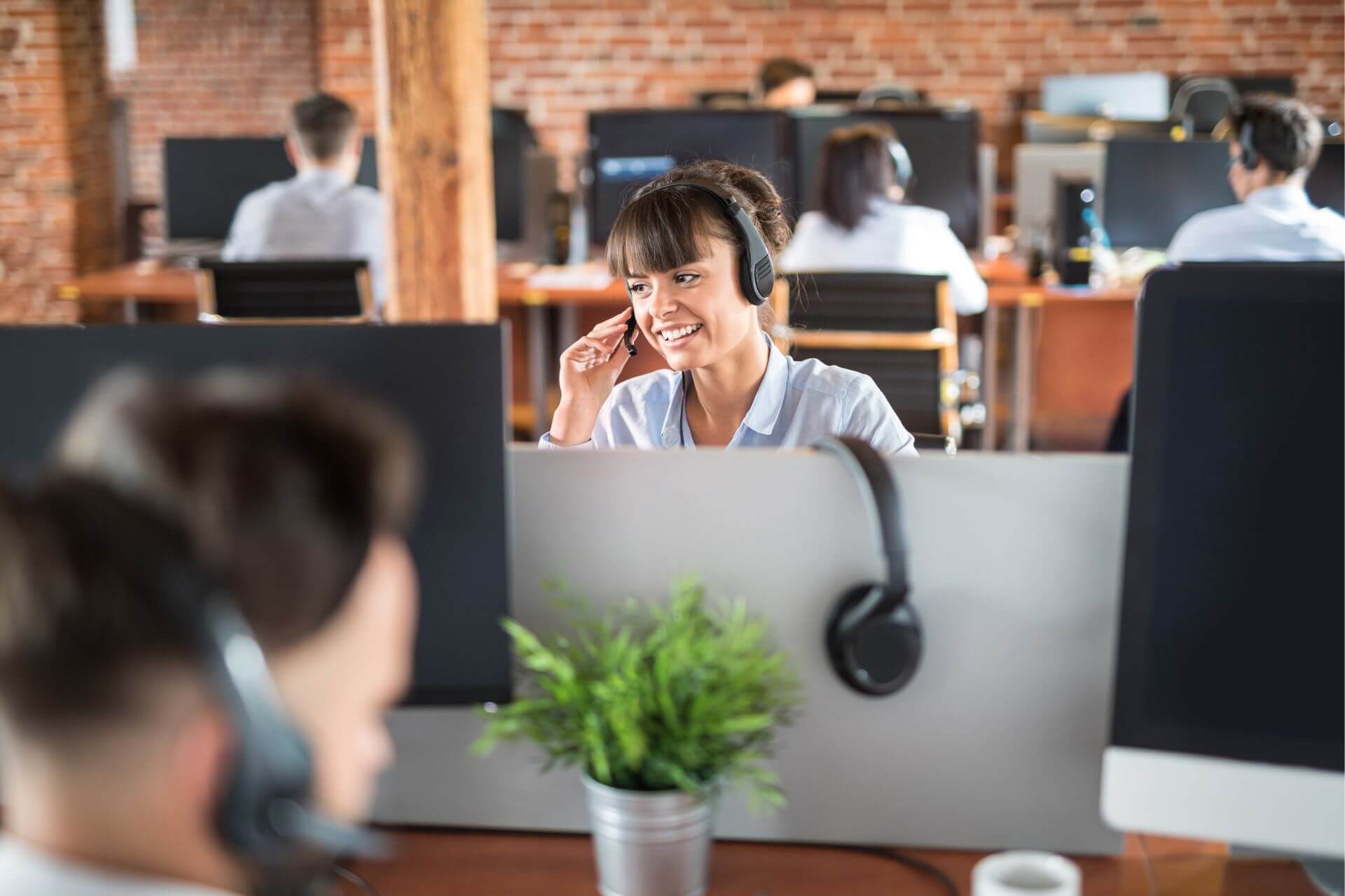 Business phone systems Mississauga office team using VoIP headsets to support customer communication
